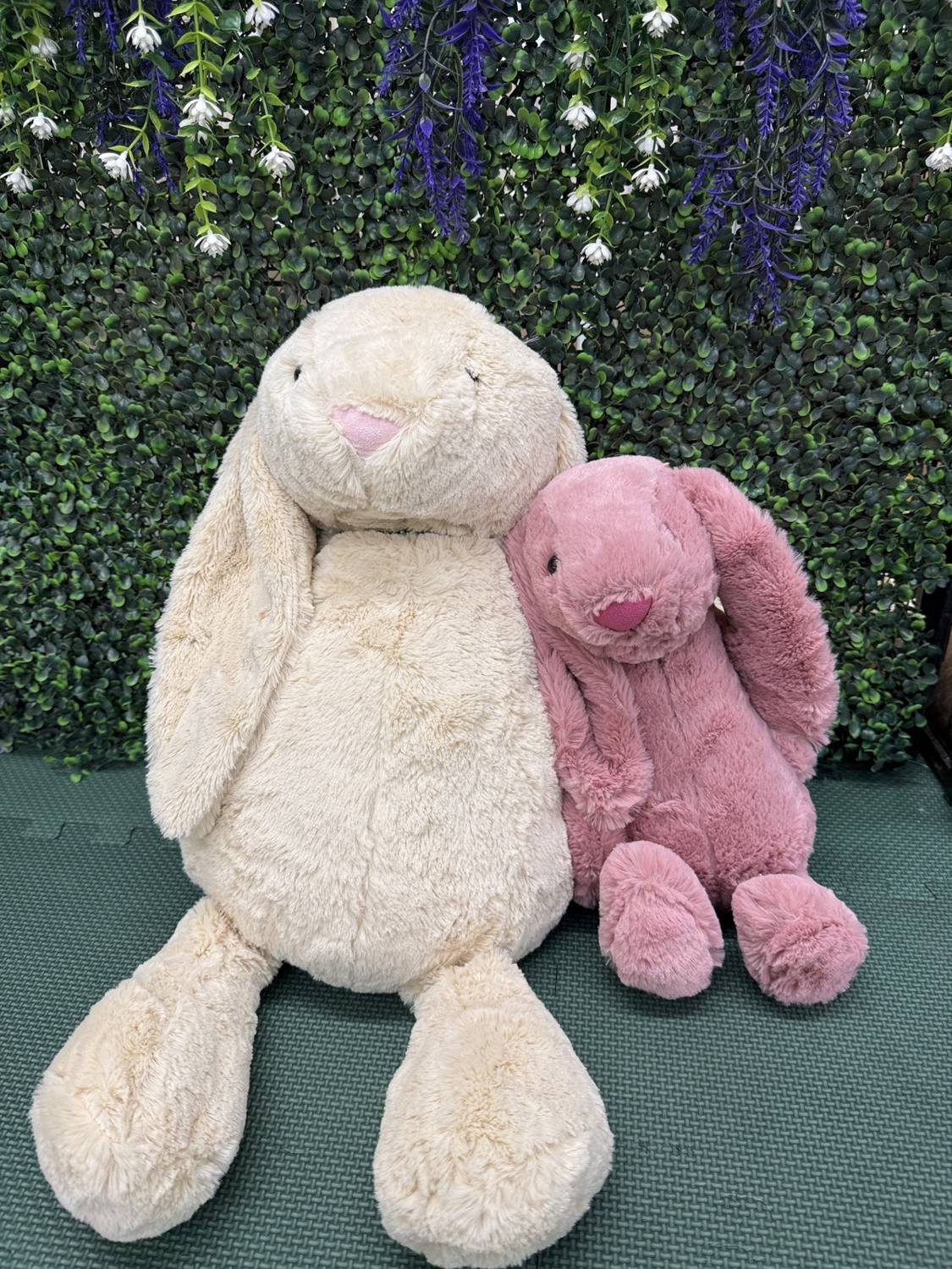 A plush bunny with a handmade beaded collar