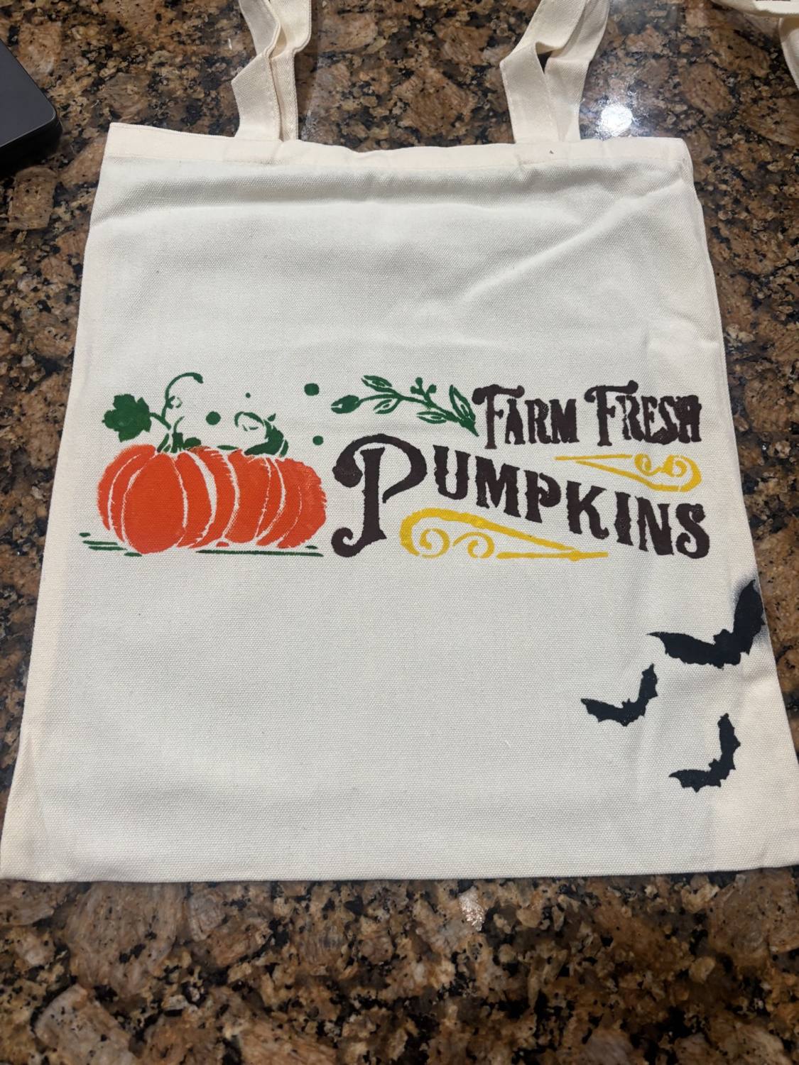 A hand-painted canvas tote bag