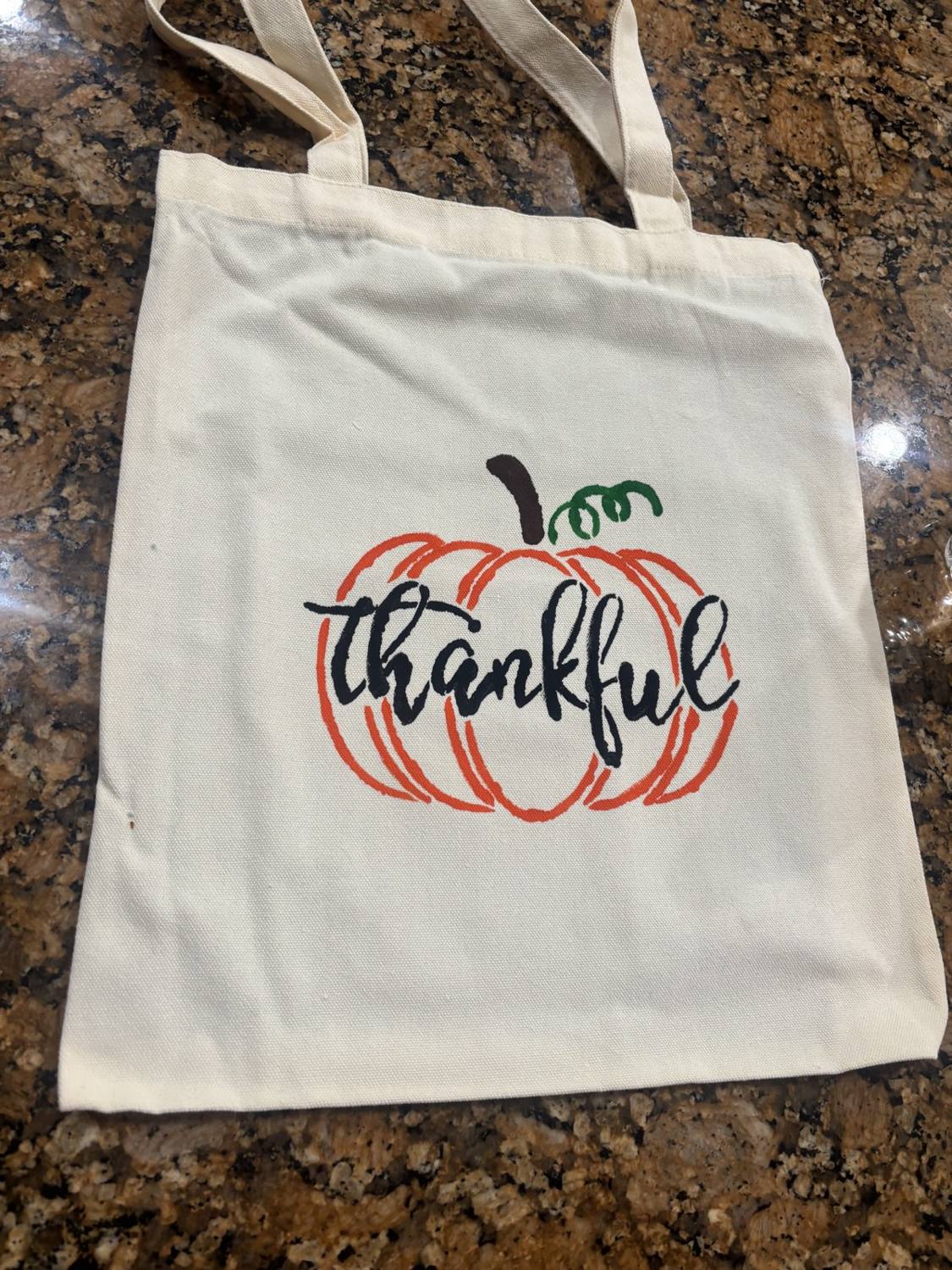 A custom painted tote bag design