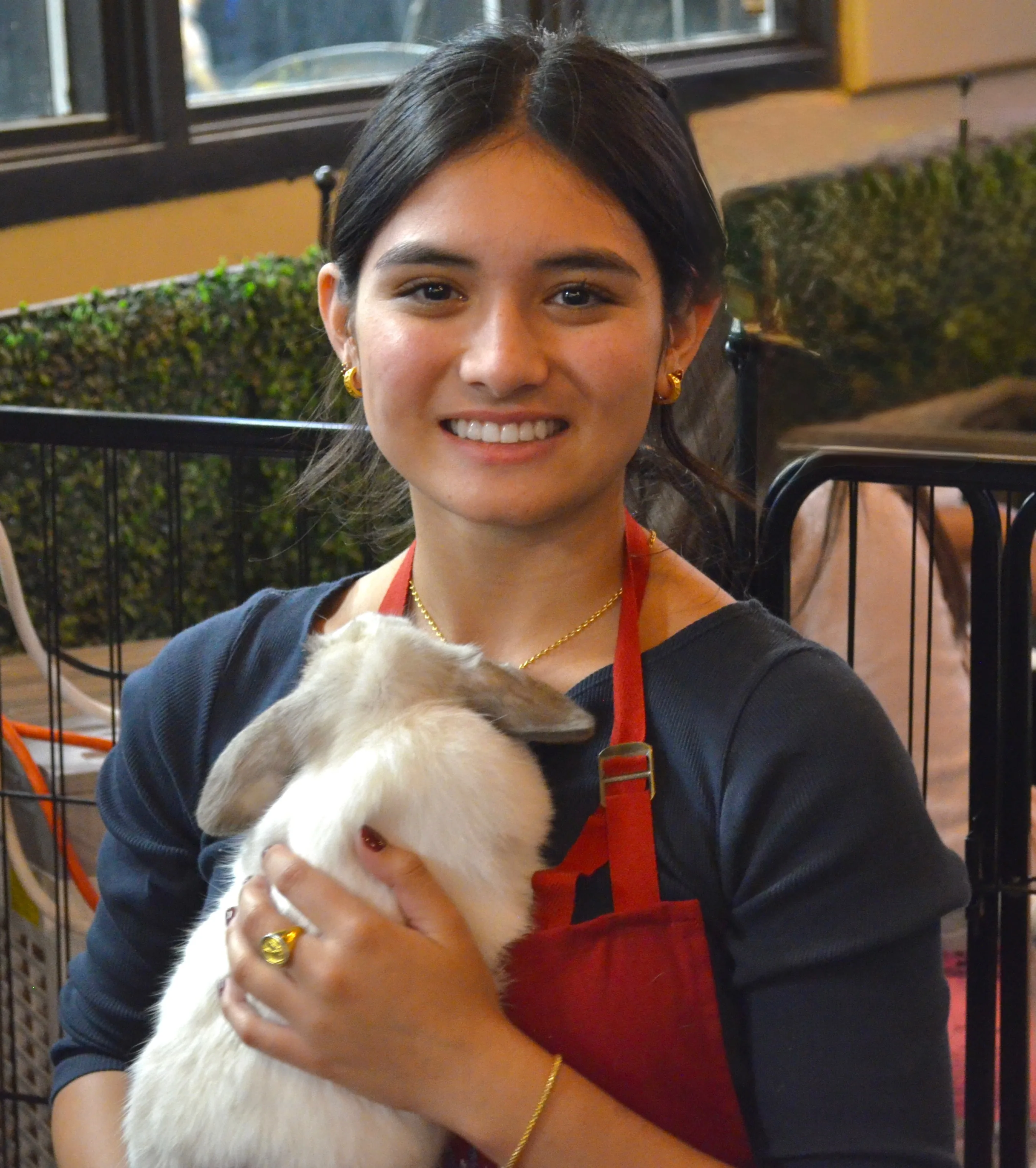 Layla, founder of Layla's Bunnyville, holding one of the bunnies